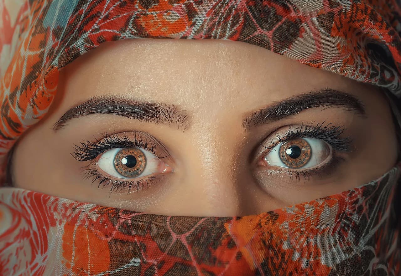 Neat, defined brows framing brown eyes