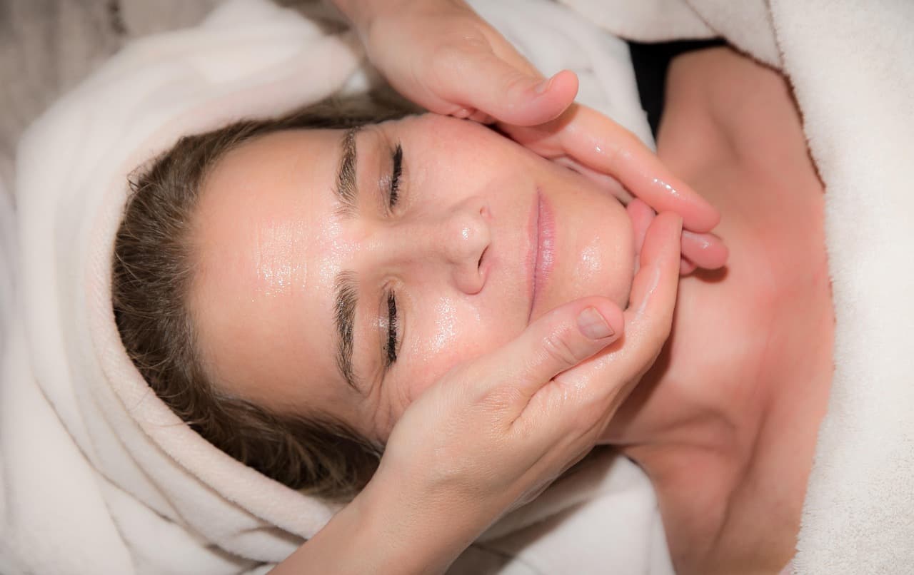 A client relaxing during a cleansing facial